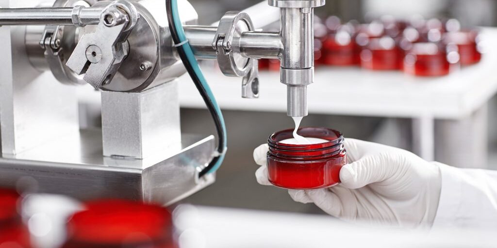 Production,And,Packaging,Of,Cosmetics,Products.,Cropped,Shot,Of,Factory Production,And,Packaging,Of,Cosmetics,Products.,Cropped,Shot,Of,Factory