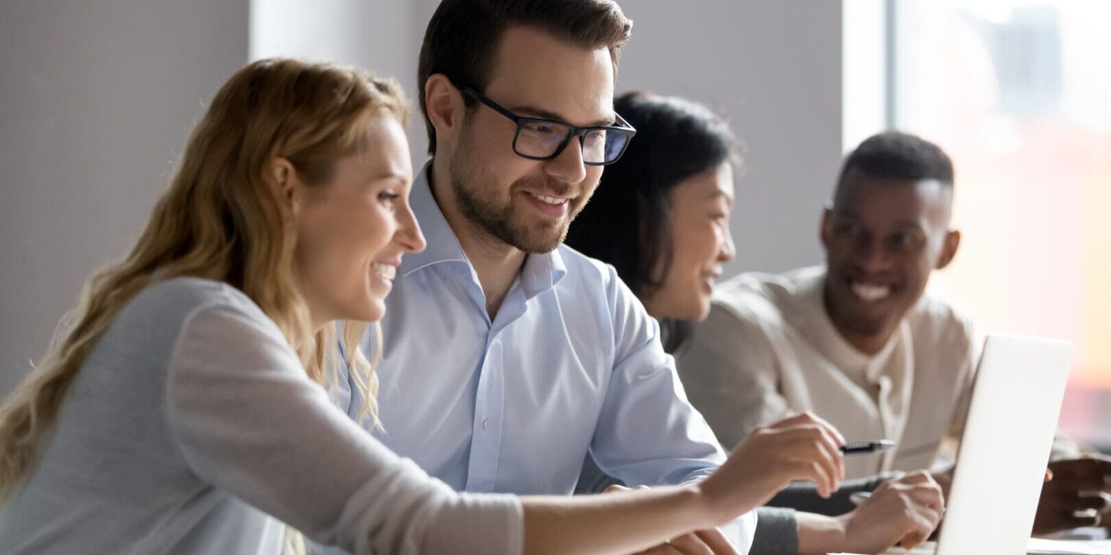 Happy,Young,Female,Employee,Discussing,Online,Project,,Showing,Computer,Presentation